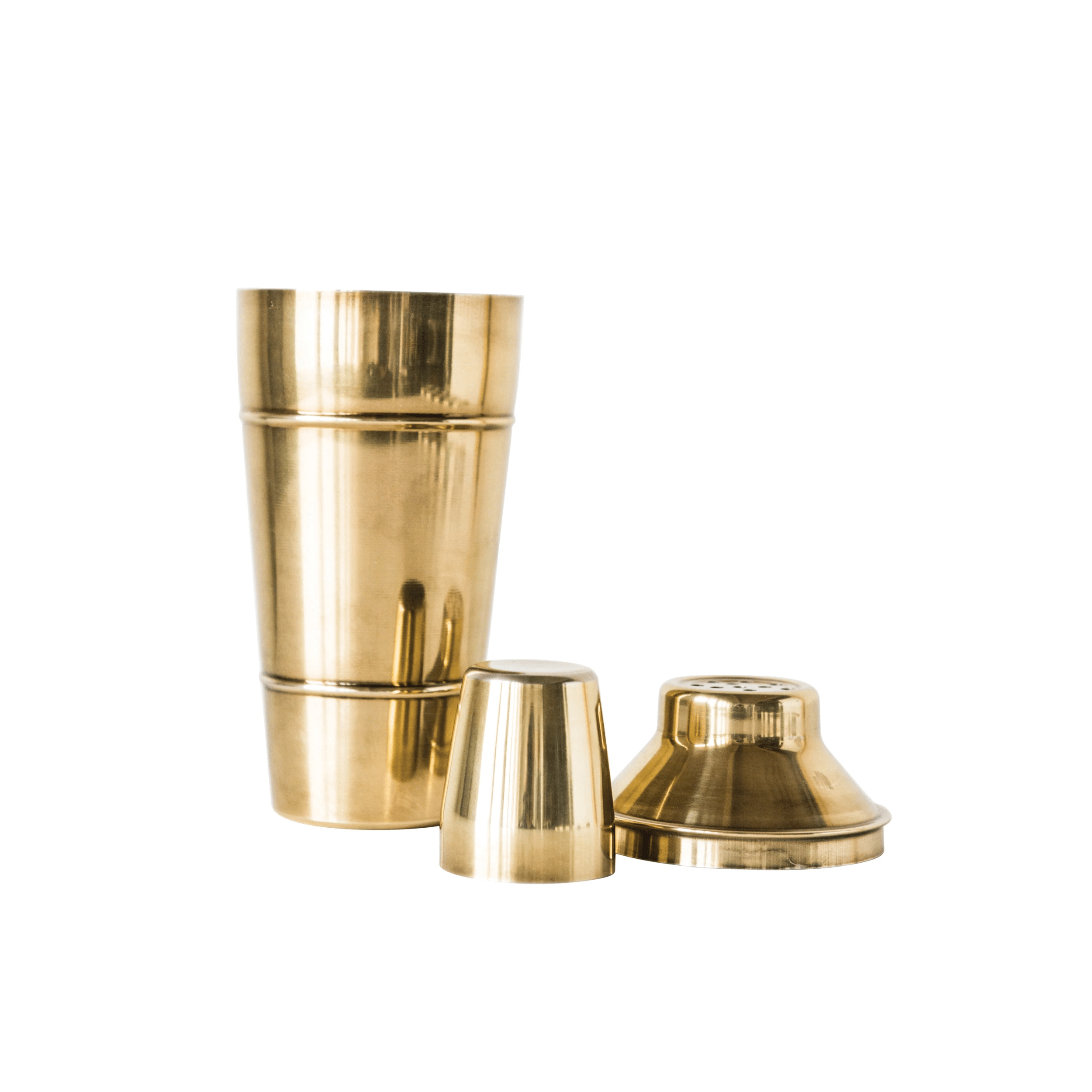 High-polished gold metal cocktail shaker with a built-in strainer and matching lid, perfect for crafting professional cocktails at home.
